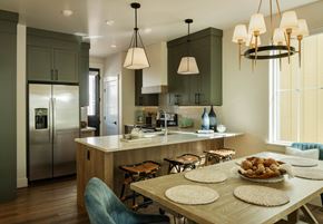 Bozeman apartment for rent - a kitchen with a large island and a table with chairs