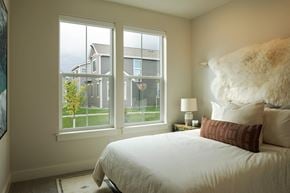Bozeman apartment for rent - a bedroom with a bed and a large window