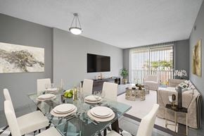 North Miami apartment for rent - A modern dining room with a glass table set for four.