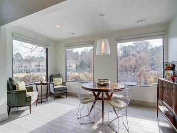 Decatur apartment for rent - a living room with a table and chairs and a large window