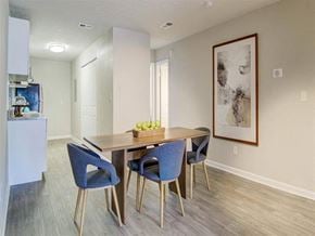 Decatur apartment for rent - a dining room with a wooden table and blue chairs