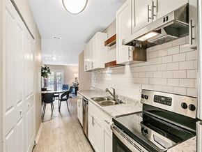 Decatur apartment for rent - a white kitchen with a stove and a sink