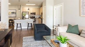 Oakwood apartment for rent - a living room and kitchen with a couch and a table