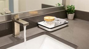 Oakwood apartment for rent - a bathroom sink with a soap dispenser on it