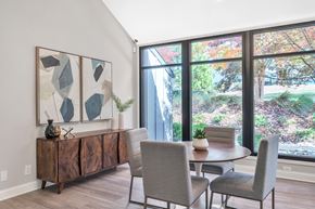 Raleigh apartment for rent - a dining room with a table and chairs and a large window