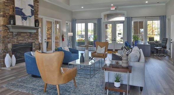 Greenville apartment for rent - a living room with couches and chairs and a fireplace