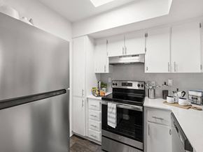 Clearwater apartment for rent - a kitchen with stainless steel appliances and white cabinets
