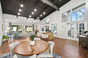Tampa apartment for rent - a living room with a dining room table and a kitchen