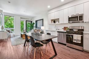 Sacramento apartment for rent - A modern kitchen with a dining table and chairs.