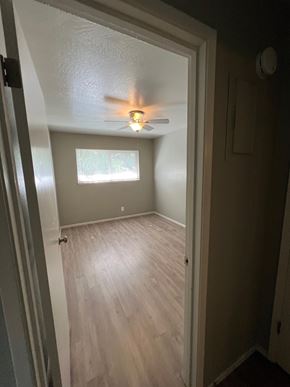 Sacramento apartment for rent - an empty room with a ceiling fan and a window