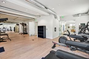 Sacramento apartment for rent - A gym with treadmills, weights, and exercise equipment.