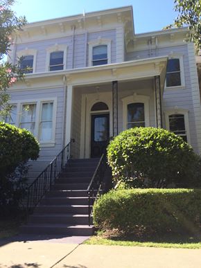 Sacramento apartment for rent - a white house with stairs in front of it