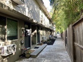 Sacramento apartment for rent - the side of a building with a sidewalk