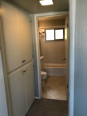 Sacramento apartment for rent - A small bathroom with a toilet and a bathtub.