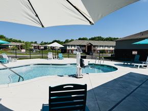 Bardstown apartment for rent - A pool area with a chair and umbrella.