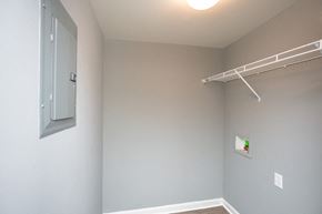 Bardstown apartment for rent - A white wall with a white shelf and a white door.