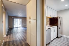 Fairfield apartment for rent - A kitchen with white cabinets and a refrigerator.