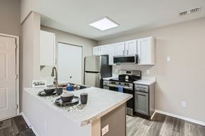 Canal Winchester apartment for rent - A kitchen with a white countertop and stainless steel appliances.