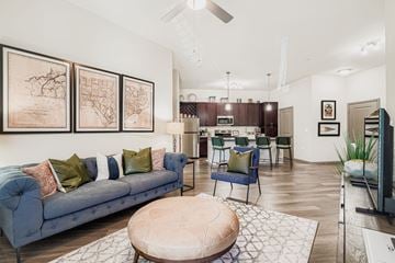 Huntersville apartment for rent - A living room with a blue couch and a coffee table.