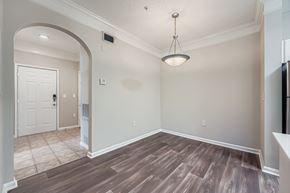 Alpharetta apartment for rent - A room with a white door and a light brown floor.