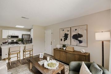 Canal Winchester apartment for rent - A living room with a brown coffee table and a green couch.