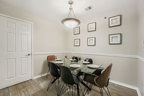 Alpharetta apartment for rent - A dining room with a glass table and chairs.