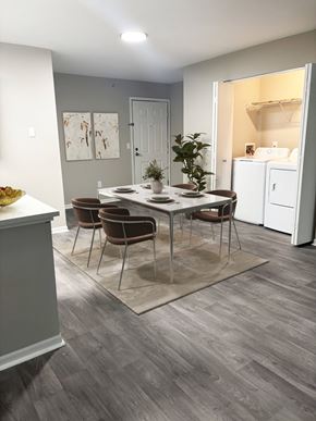 Columbus apartment for rent - A dining room with a table set for four and chairs around it.