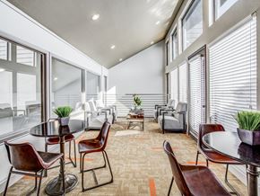 Fort Worth apartment for rent - A modern dining room with a glass table and chairs.