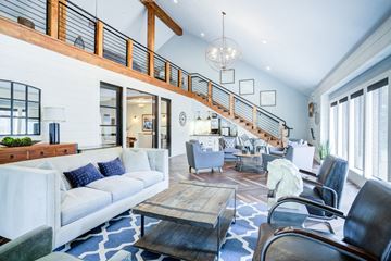 Wilsonville apartment for rent - A living room with a white couch and a wooden coffee table.