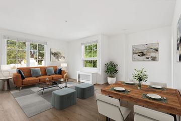 Portland apartment for rent - A modern living room with a wooden table set for two.
