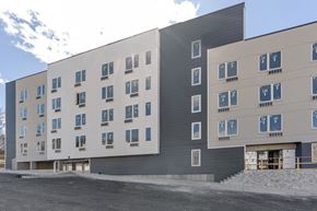 North Bergen apartment for rent - a large building with many windows and a street in front of it