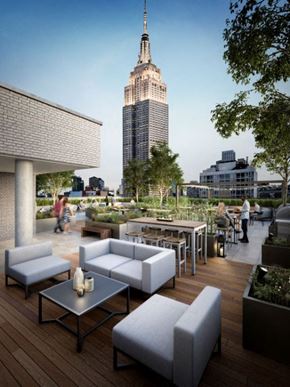 New York apartment for rent - a rendering of the rooftop terrace with a view of the empire state building