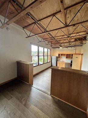Washougal apartment for rent - an empty room with a kitchen and a large window