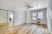 Portland apartment for rent - A room with a ceiling fan and a window.