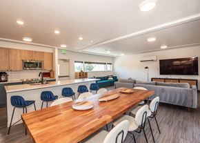 Portland apartment for rent - A modern kitchen with a dining table and chairs at Society 62 Apartments, Oregon