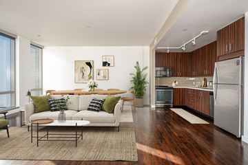 Portland apartment for rent - A modern living room with a white couch and a coffee table.