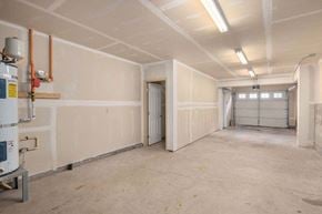 Tacoma townhouse for rent - a large room with white walls and a door