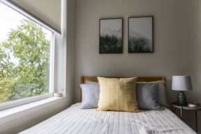 Portland apartment for rent - a bedroom with a bed and a large window at Shift, Portland, 97217