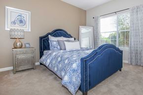 Columbia apartment for rent - a bedroom with a bed and a window at Carrington Place at Wildewood, Columbia, SC 29223