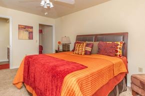 Columbia apartment for rent - a bedroom with a bed and a ceiling fan at Arbors at Windsor Lake, Columbia, SC 29223