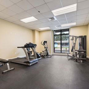 Miami apartment for rent - A spacious gym with treadmills, elliptical machines, and other exercise equipment.
