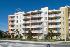 Homestead apartment for rent - a large apartment building on the side of a street