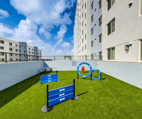 Miami apartment for rent - A blue sign with the number 111 is in the foreground of a grassy area.