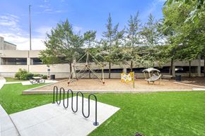 Atlanta apartment for rent - A playground with a swing set and a slide.