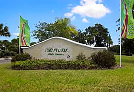 Ellenton apartment for rent - a building with a green and red flag in front of it