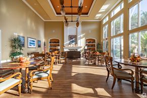 Port Richey apartment for rent - A large dining room with wooden floors and furniture.