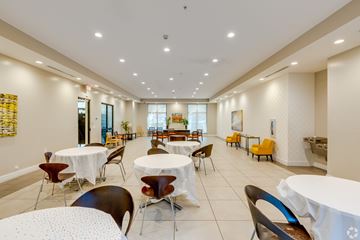 Miami apartment for rent - A dining room with tables and chairs.