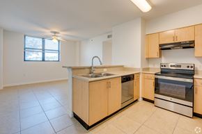 Miami apartment for rent - A kitchen with a sink, stove, and oven.