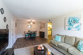 North Charleston apartment for rent - A living room with a couch, a coffee table, and a television.at Bradley Square, North Charleston, SC