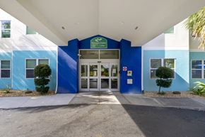 Clearwater apartment for rent - The entrance to a building with a blue and white color scheme.